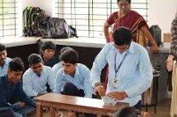 Student practising  to packing petry dish in paper to keep in Autoclave