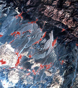 A three-band color composite made from images (at 23 m resolution) acquired by the IRS LISS, showing mountains, alluvial plains and fans, and scattered oases of vegetation in southern Iran.