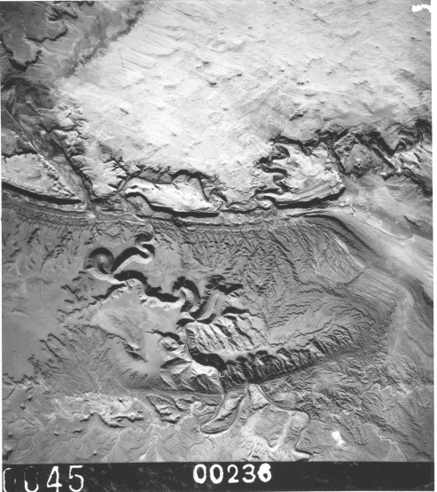 Small scale photo taken from a high-flying NASA U-2 aircraft that shows a part of the Colorado Plateau where the Green River has entrenched into the rock strata.