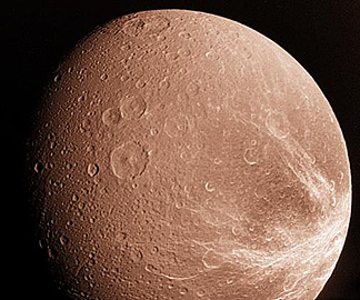 View of Dione, in a near natural color version, seen by Voyager.