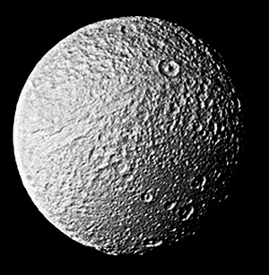 Another view of Tethys, with Ithaca Chasma in the upper left.