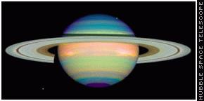 Color enhanced image of Saturn and its rings made by the NICMOS camera on the Hubble Space Telescope.