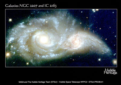 The smaller galaxy IGC2163 in the process of interacting with the larger NGC2007 galaxy.