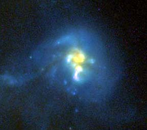 Four galaxies merging into an eventual composite (probably will become an elliptical galaxy), imaged by the ACS (visible) and NICMOS (infrared) sensors on HST.