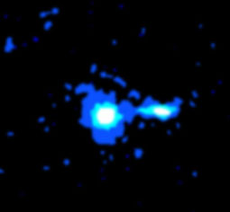 A quasar in galaxy M1000, with density-slice levels of x-radiation as picked up by the Chandra X-Ray Observatory.