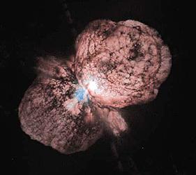 Enlargement of the central gaseous dumbell shaped envelope around Eta Carinae, as imaged through red and ultraviolet filters on the HST camera.