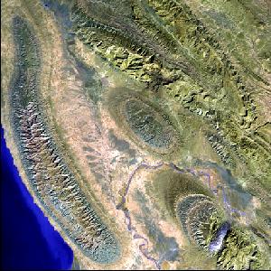 Anticlines in western Iran; Landsat-7 ETM+ 10 m resolution image; note that several anticlines have been breached to expose shale (gray, much dissected) in their central cores.